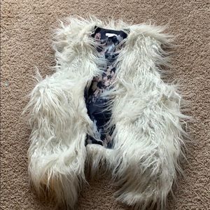 White furry vest